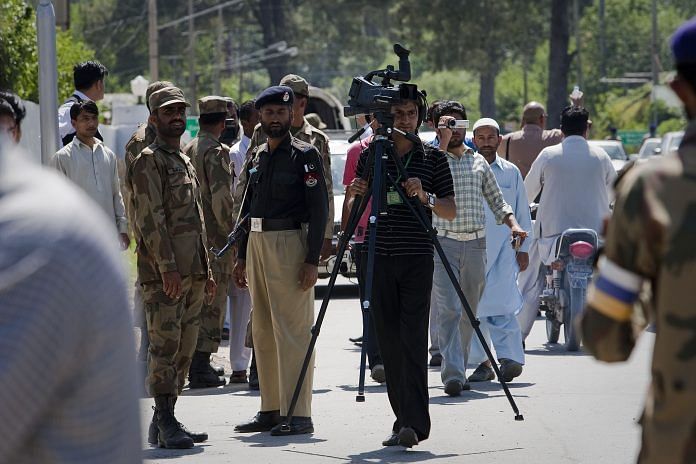 (Representative image) Pakistani media gather on the outskirts of Bilal Town