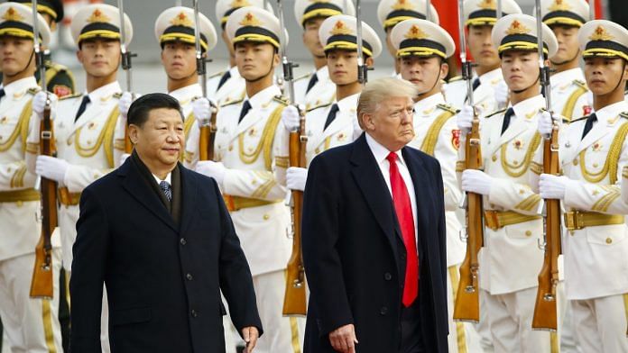 US President Donald Trump takes part in a welcoming ceremony with China’s President Xi Jinping in Beijing, China on 9 November, 2017.