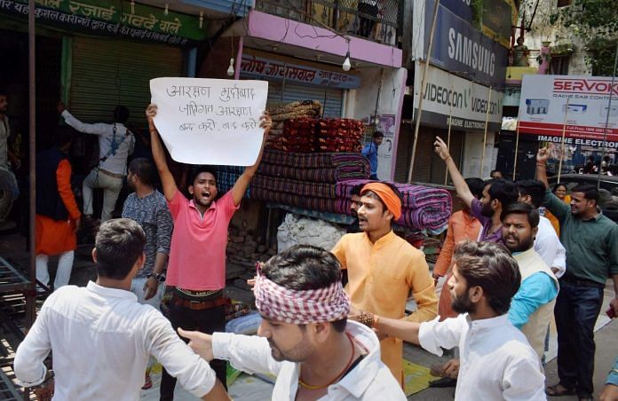 Activists force closure of shops at a market during Bharat Bandh, called over SC/ST reservation issue, in Allahabad | PTI