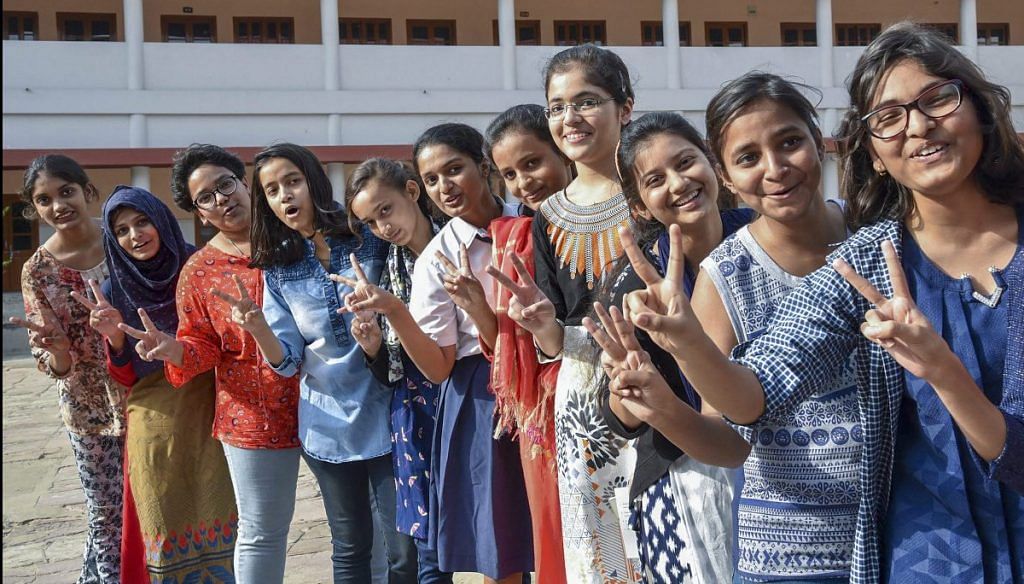 Girl students flash the victory sigh after ICSE results in Patna