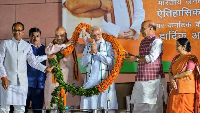 Prime Minister Narendra Modi being felicitated by BJP leaders (L-R) Shivraj Singh Chouhan, Nitin Gadkari, Amit Shah, Rajnath Singh and Sushma Swaraj