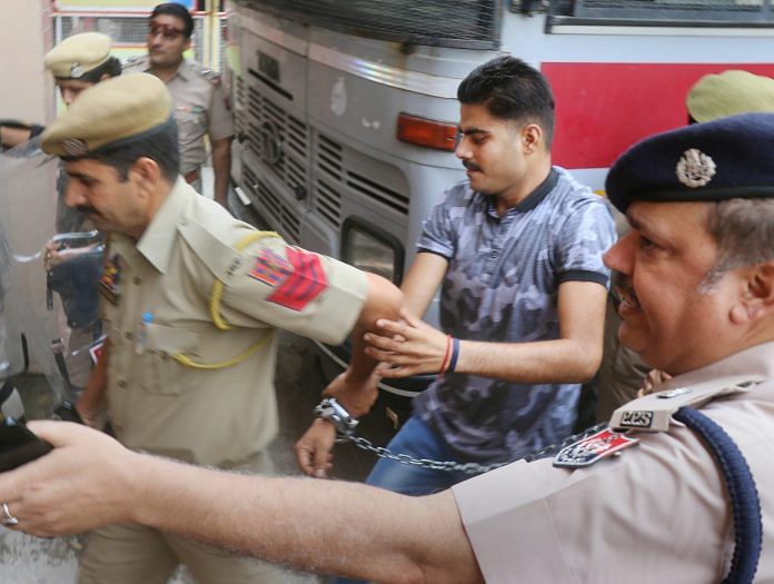One of the eight accused in the alleged Kathua rape and murder case being brought to district sessions court | PTI
