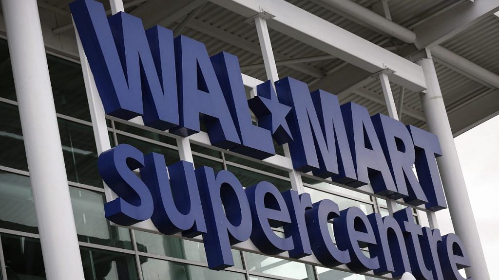 A "WalMart supercentre" logo above the entrance to an Asda supermarket in the UK
