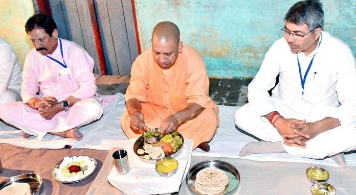 Yogi Adityanath at Dalit homes. Dalit outreach is a farce