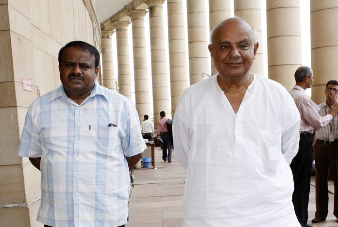 File photo of H.D. Deve Gowda with son Kumaraswamy | Sipra Das/India Today Group/Getty Images