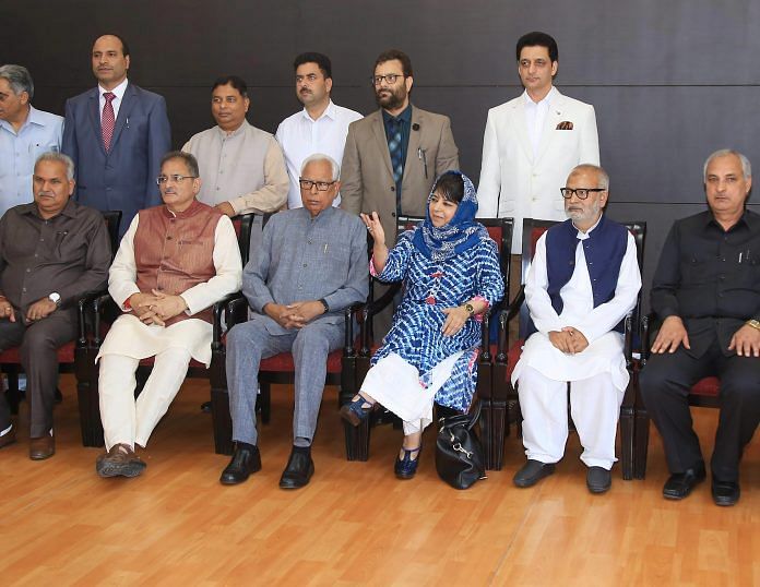 Jammu and Kashmir Governor NN Vohra and Chief Minister Mehbooba Mufti with Deputy Chief Minister Kavinder Gupta and newly appointed ministers after a reshuffle