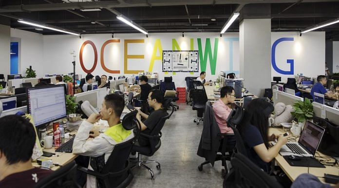 Employees work at Anker's headquarters in Shenzhen Photographer