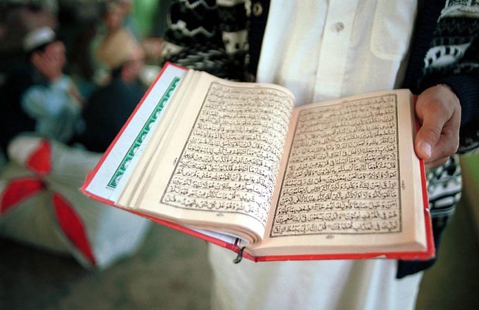Boys read the Koran at a Madrassa | Lynsey Addario/Bloomberg