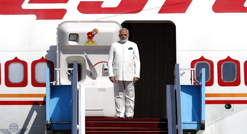 Prime Minister Narendra Modi disembarks from his plane near Tel Aviv in 2017