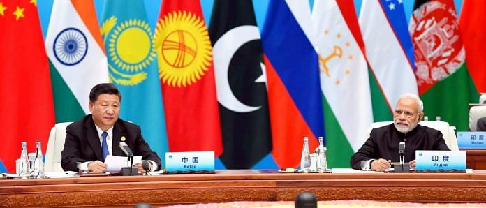Narendra Modi and Xi Jinping at the Plenary Session of the Shanghai Cooperation Organisation (SCO) Summit, in Qingdao, China on 10 June 2018