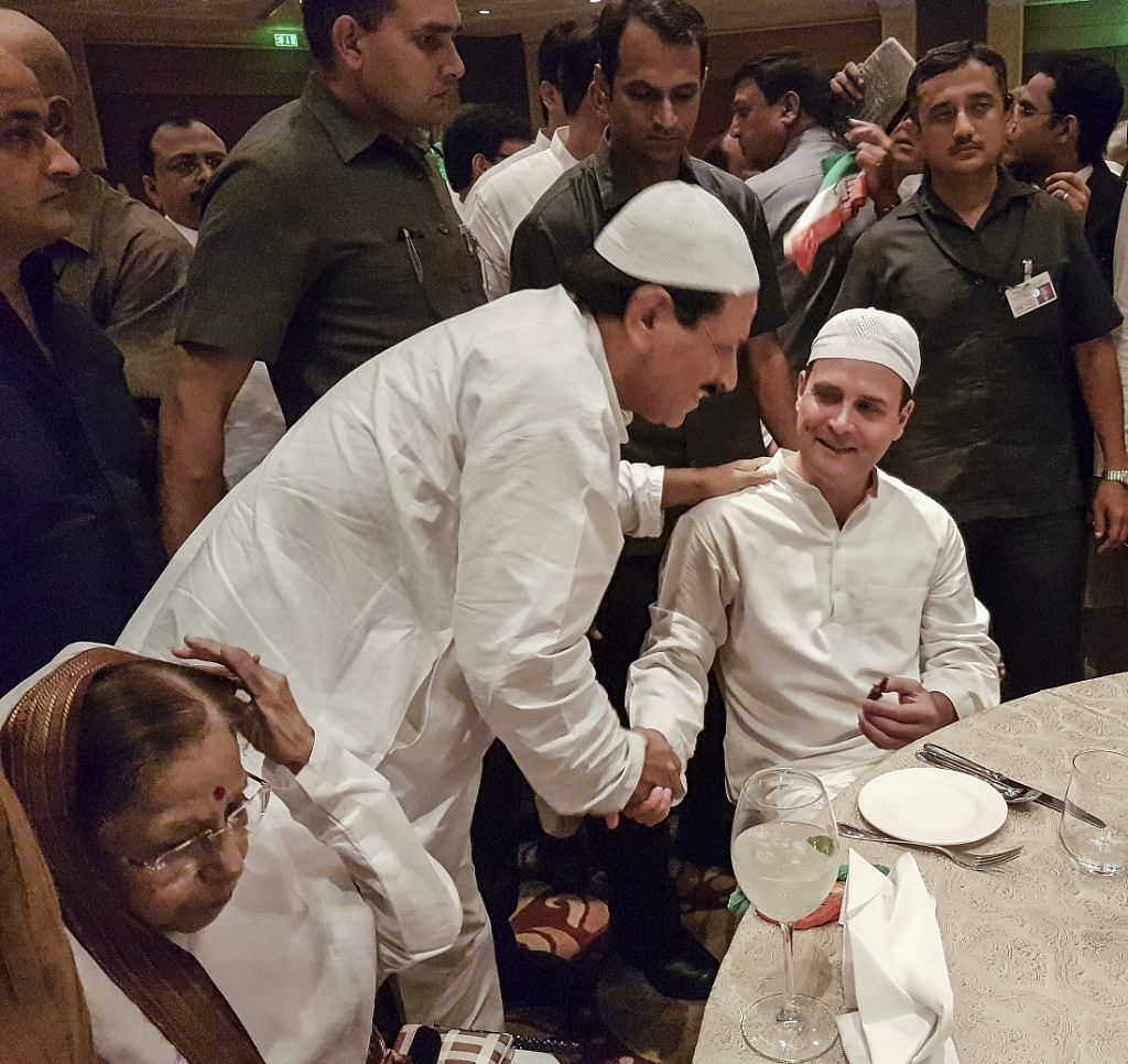 A guest greets Congress President Rahul Gandhi during his Iftar party in New Delhi | Sanjeev Chopra/PTI