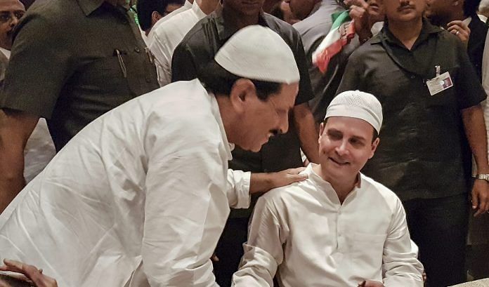 A guest greets Congress President Rahul Gandhi during his Iftar party in New Delhi | Sanjeev Chopra/PTI