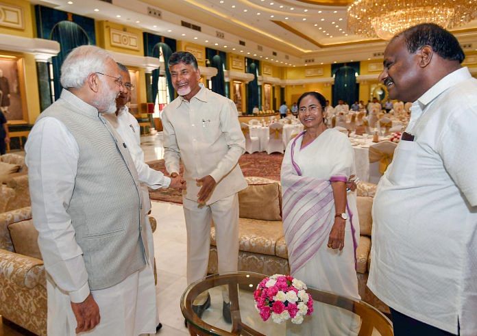 PM Narendra Modi shakes hands with Andhra Pradesh CM N Chandrababu Naidu as Karnataka CM H D Kumaraswamy, West Bengal Chief Minister Mamata Banerjee and Kerela CM Pinarayi Vijayan | PTI