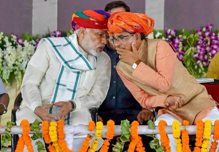 Prime Minister Narendra Modi and Madhya Pradesh Chief Minister Shivraj Singh Chouhan in Rajgarh, Madhya Pradesh ~ PTI