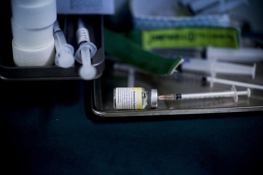A syringe sits in a vial of Ketamine | Bloomberg