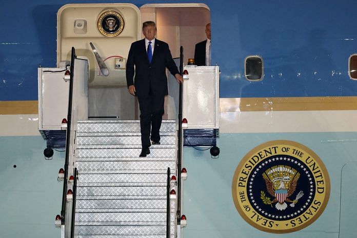 U.S. President Donald Trump disembarks from Air Force One at the Paya Lebar Air Base in Singapore