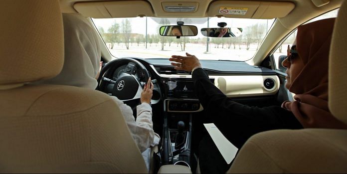 An instructor guides her trainee in driving skills during a training drive at the Saudi Aramco driving school for women