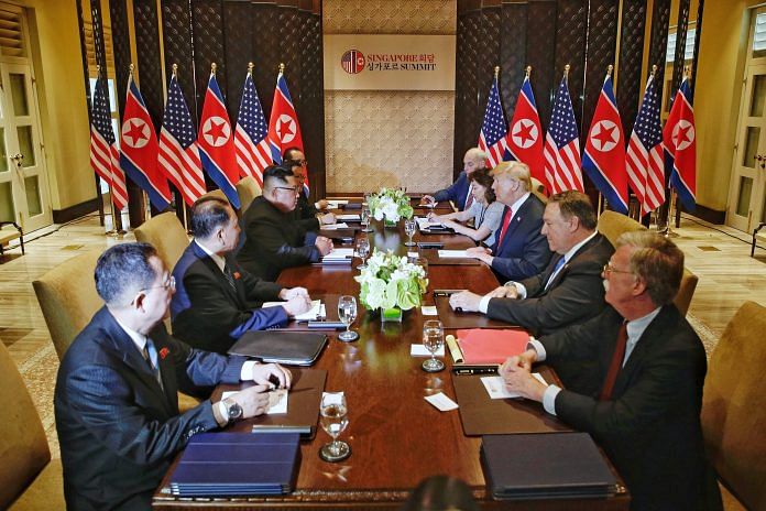 North Korean leader Kim Jong-un meets with U.S. President Donald Trump during their historic U.S.-DPRK summit at the Capella Hotel on Sentosa island, Singapore