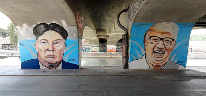 Street art depicting Kim and Trump | Commons