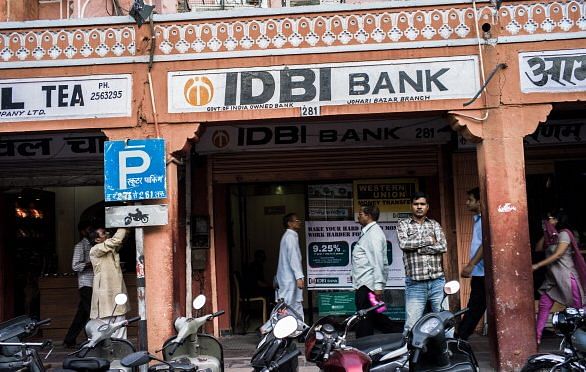 A pedestrian walks past an IDBI Bank Ltd. automated teller machine (ATM) branch in Jaipur. Photograph: Sanjit Das/Bloomberg via Getty Images