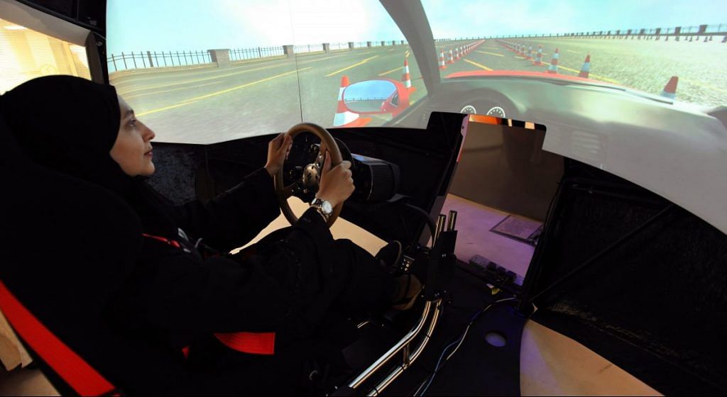 A woman learns using a driving simulator | Mohammed Al-Nemer/Bloomberg