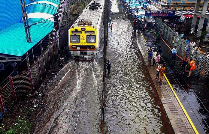 File photo of a local train on waterlogged tracks during heavy rainfall in Mumbai. (PTI Photo)