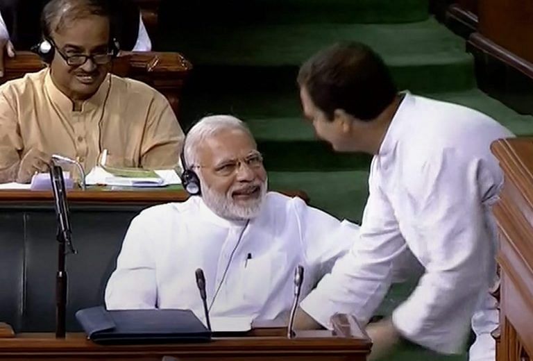 Rahul Gandhi may be hugging Modi in Parliament, but their parties are fighting on social media