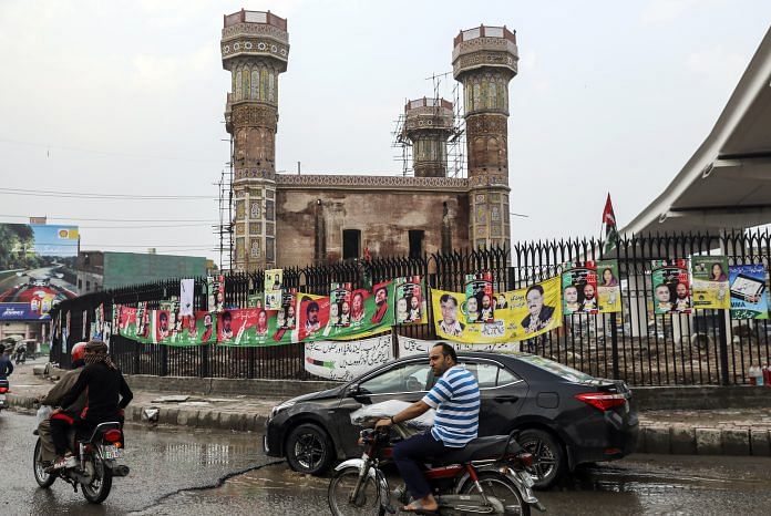 Campaign posters in Lahore, Pakistan | Asad Zaidi/Bloomberg