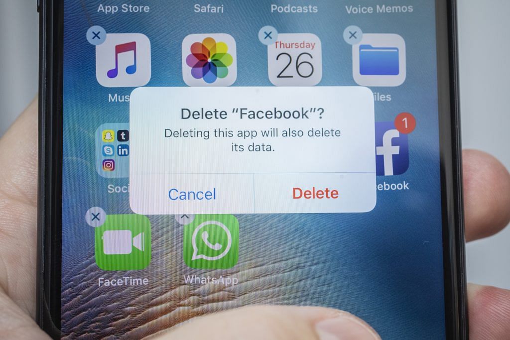 A "Delete Facebook" message is displayed on an iPhone. Facebook shares plunged 19 per cent after second-quarter sales and user growth missed Wall Street estimates | Bloomberg