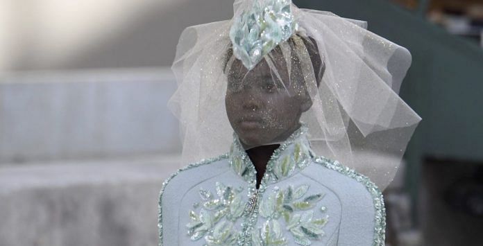 South Sudanese-Australian model Adut Akech presents a creation by Chanel | ALAIN JOCARD/AFP/Getty Images