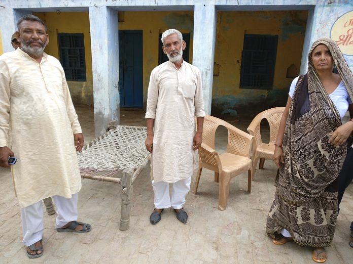 Narayan Singh Solanki (C) and Vishnu (L) at the site of the 'panchayat'. They have been accused by Shri Krishna for caste-based violence | ThePrint.in