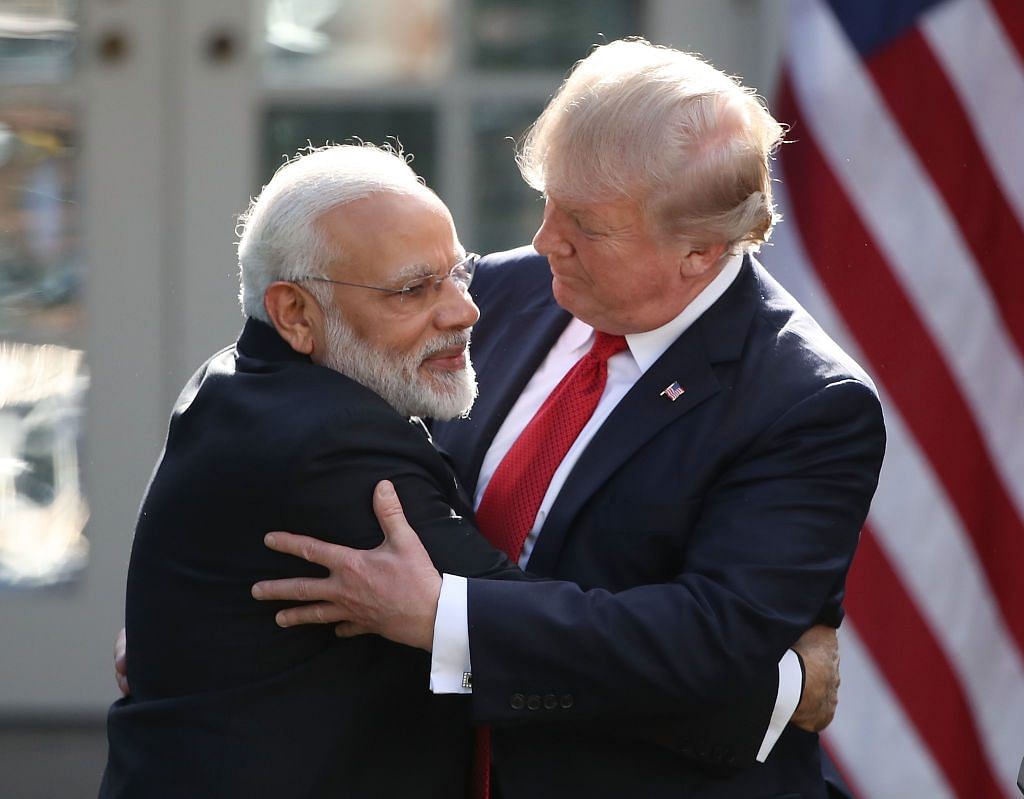 U.S. President Donald Trump and Indian Prime Minister Narendra Modi embrace in Washington, DC | Photo by Mark Wilson/Getty Images