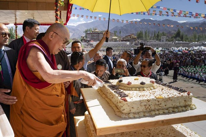 His Holiness cutting the cake in Leh | Tenzin Choejor/dalailama.com