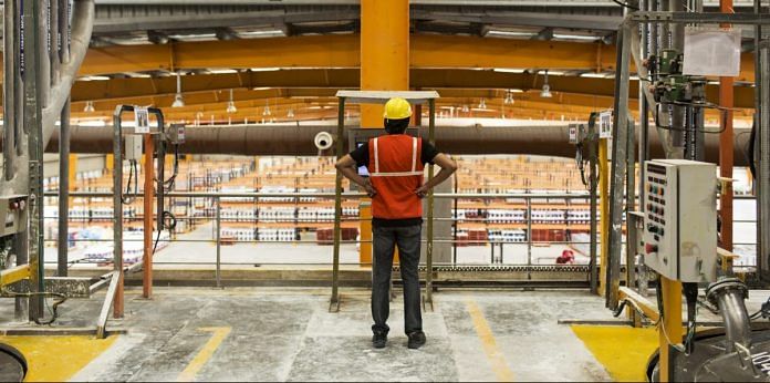A worker stands inside an Akzo Nobel India Ltd.