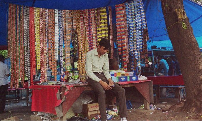 A shopkeeper selling tobacco products