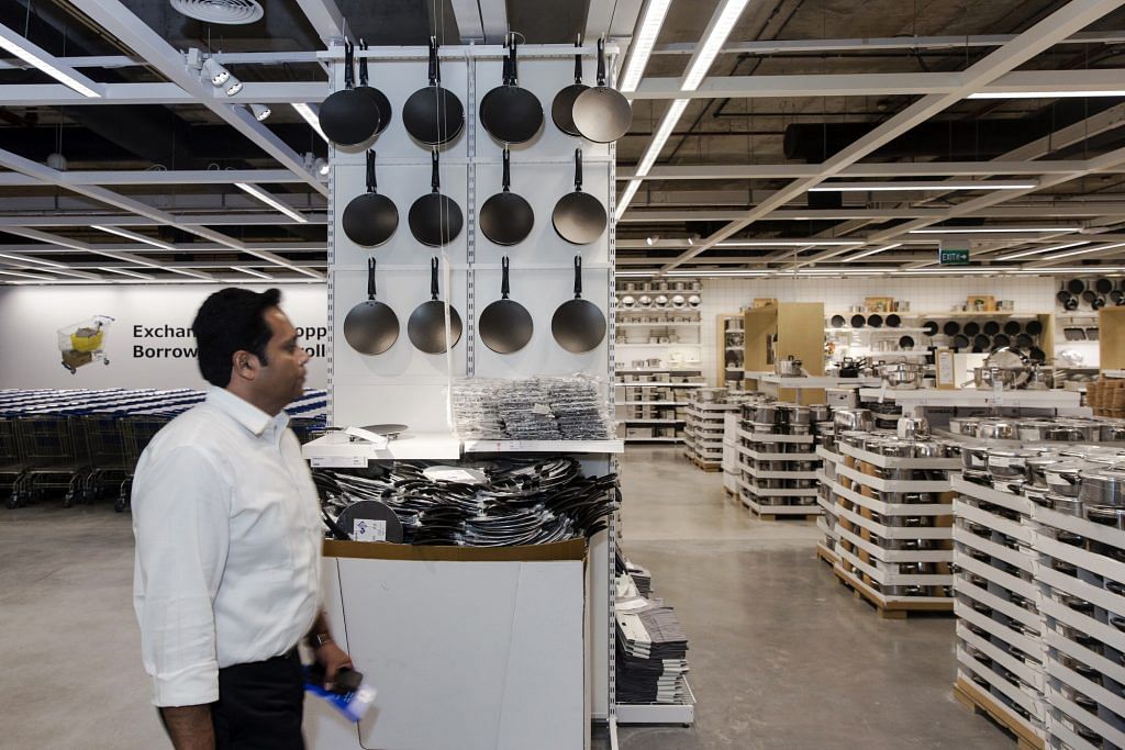 A customer walking inside the store | Udit Kulshrestha/Bloomberg