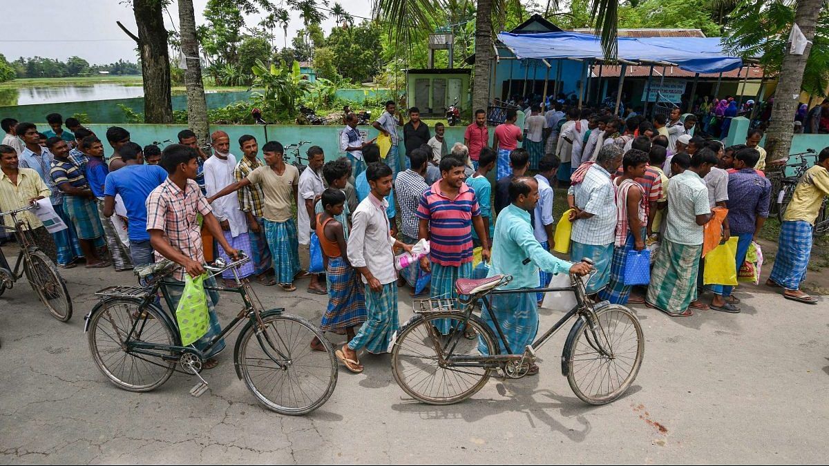 File photo: People wait to check their names on the final draft of Assam's NRC after it was released, at a NRC Seva Kendra in Nagaon in July 30, 2018. | PTI Photo