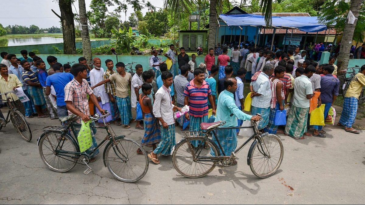 National Register of Citizens released in Assam File photo: People wait to check their names on the final draft of Assam's NRC after it was released, at a NRC Seva Kendra in Nagaon in July 30, 2018. | PTI Photo