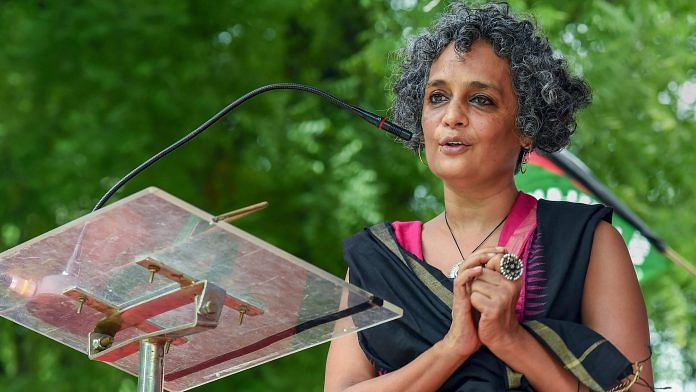Author and activist Arundhati Roy addresses a protest organised by the activists of Campaign against State Repression on Rights over various issues, at Jantar Mantar in New Delhi in August, 2018. | PTI