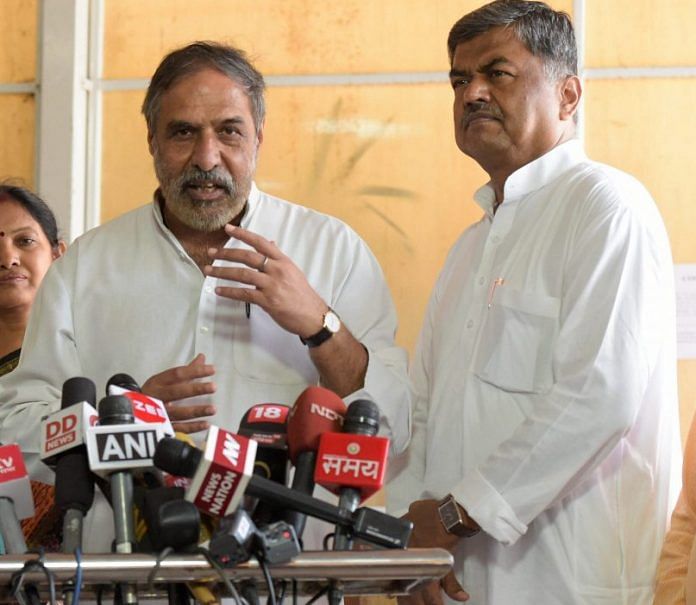 Congress MP Anand Sharma addresses the media as UPA candidate B.K. Hariprasad (R) looks on | PTI