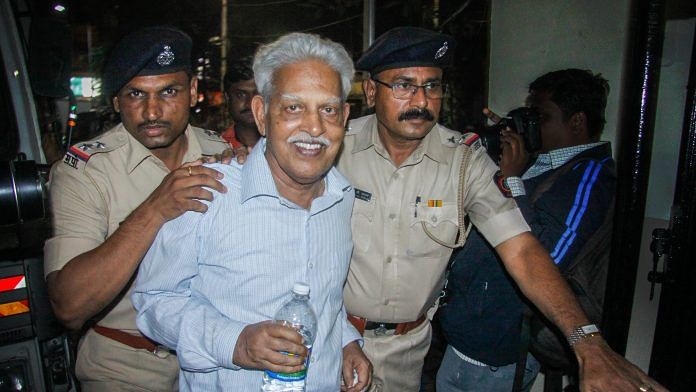 File photo of poet P Varavara Rao, arrested in connection with the Bhima Koregaon case, being produced at a court in Pune in August 2018. | PTI