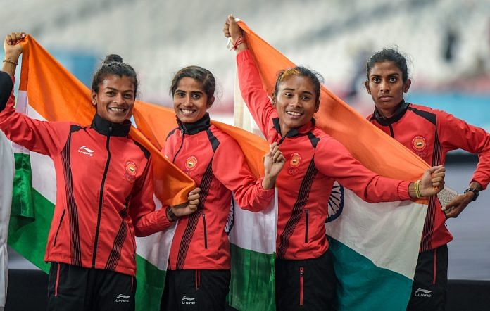 (L-R) Sarita Gayakwad, Vismaya, Hima Das and Poovamma Raju at the medal ceremony of the women's 4x400m relay event at the 18th Asian Games | PTI