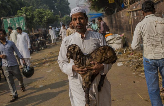 Latest news on Eid | theprint.in A man carries home a goat after Eid al-Adha prayers at Jama Masjid, New Delhi | Daniel Berehulak/Getty Images