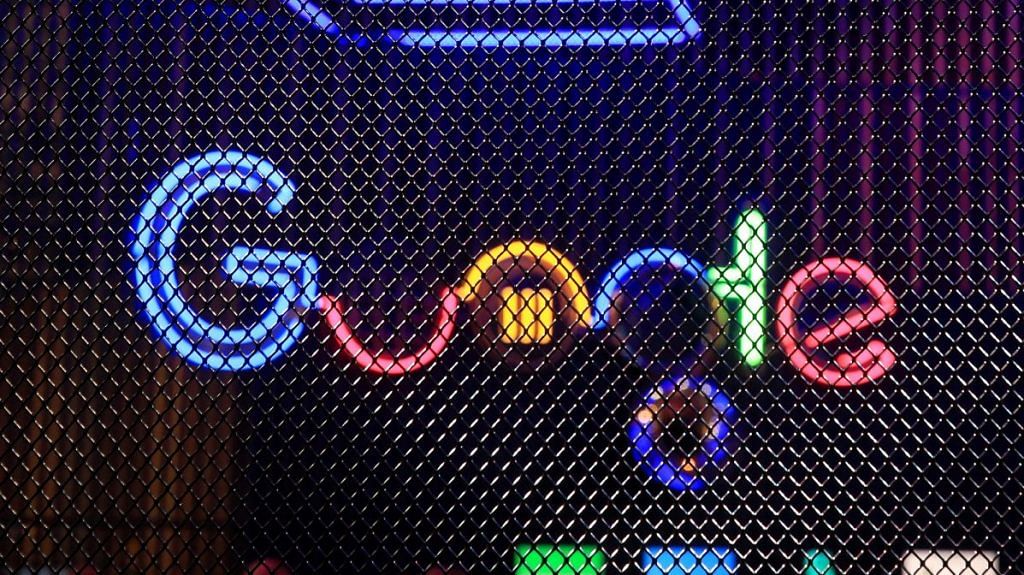 The Google Inc. logo hangs illuminated