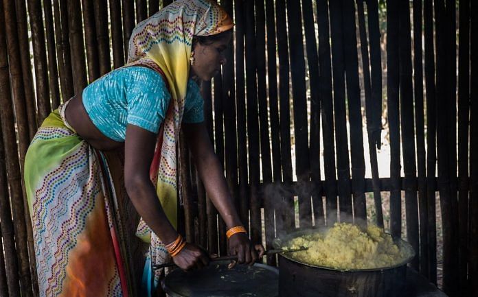 An anganwadi worker cooks a meal for children under the ICDS scheme in Maharashtra| Sanjit Das/Bloomberg
