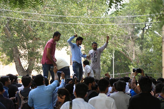 Students protesting against the faulty EVMs