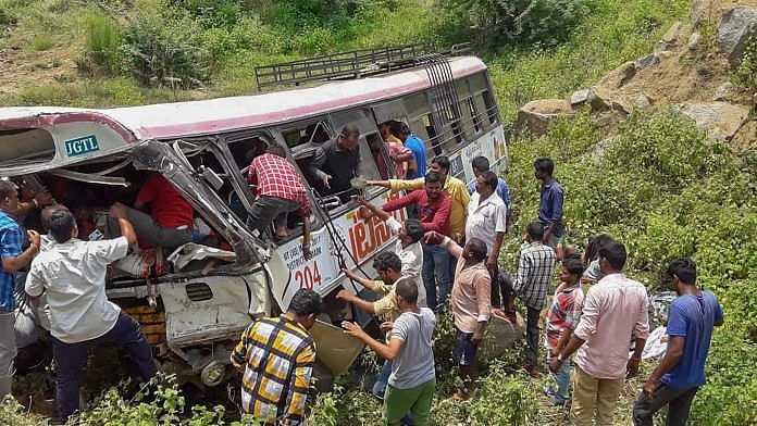 Rescue officials at the accident site where a state-owned Road Transport Corporation bus skidded into a deep gorge, at Jagtial district | PTI