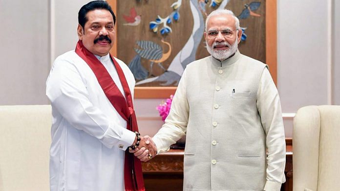 Prime Minister Narendra Modi shakes hands with former Sri Lankan president Mahinda Rajapaksa, in New Delhi | PTI
