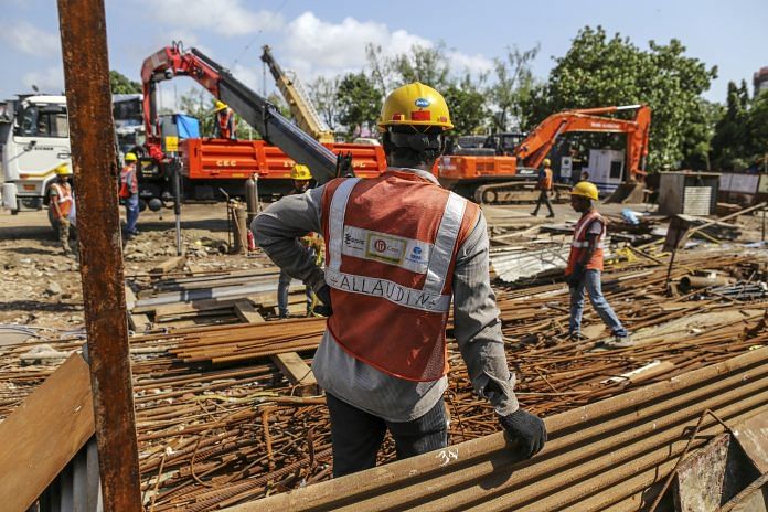 Workers prepare reinforcing steel Mumbai