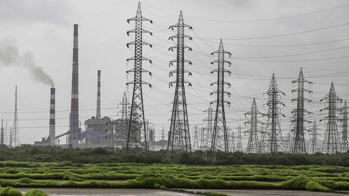 Electricity pylons | Dhiraj Singh/Bloomberg